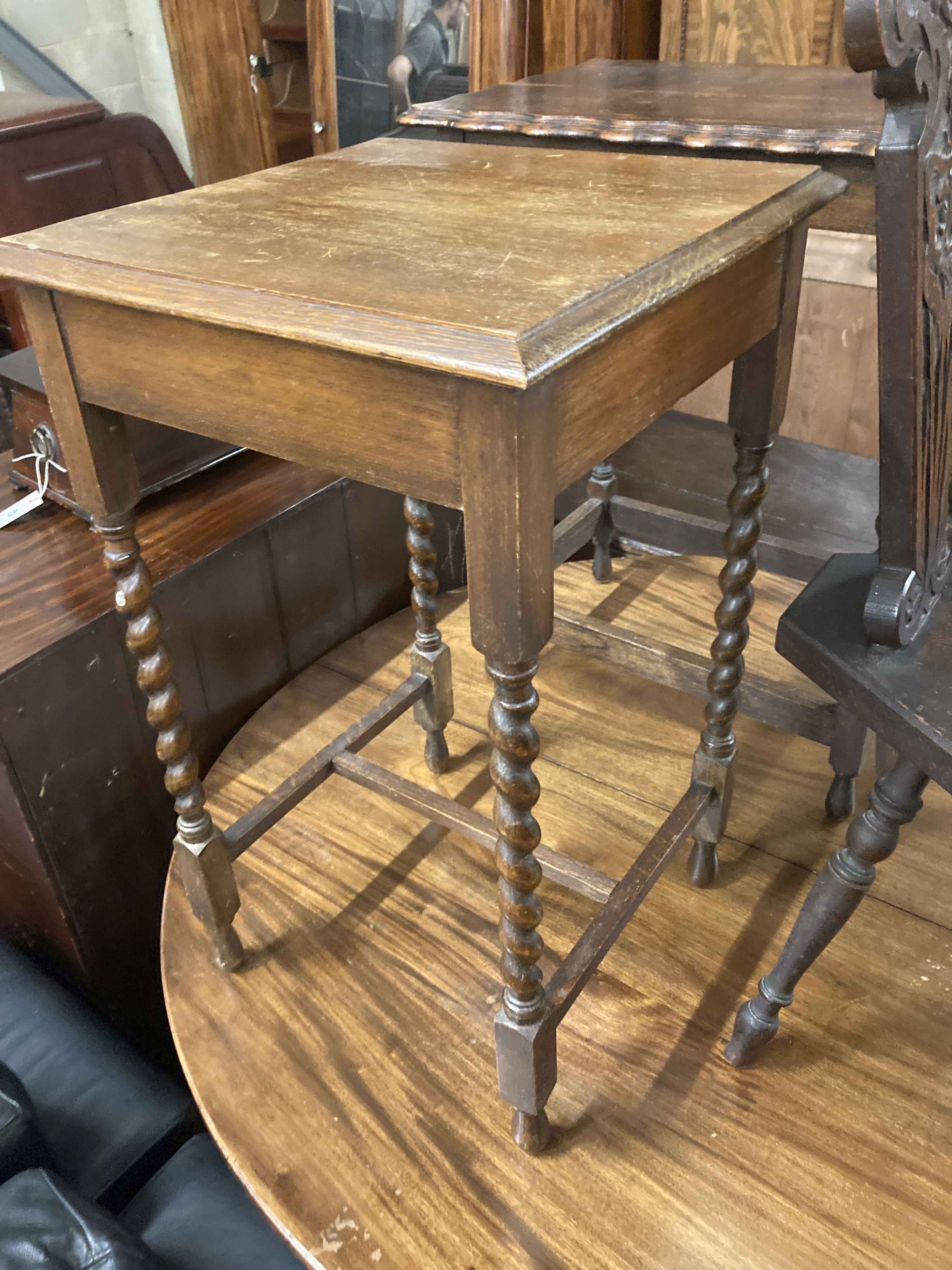 Two 1920s oak occasional tables, larger width 60cm, depth 37cm, height 72cm, together with a carved oak spinning chair